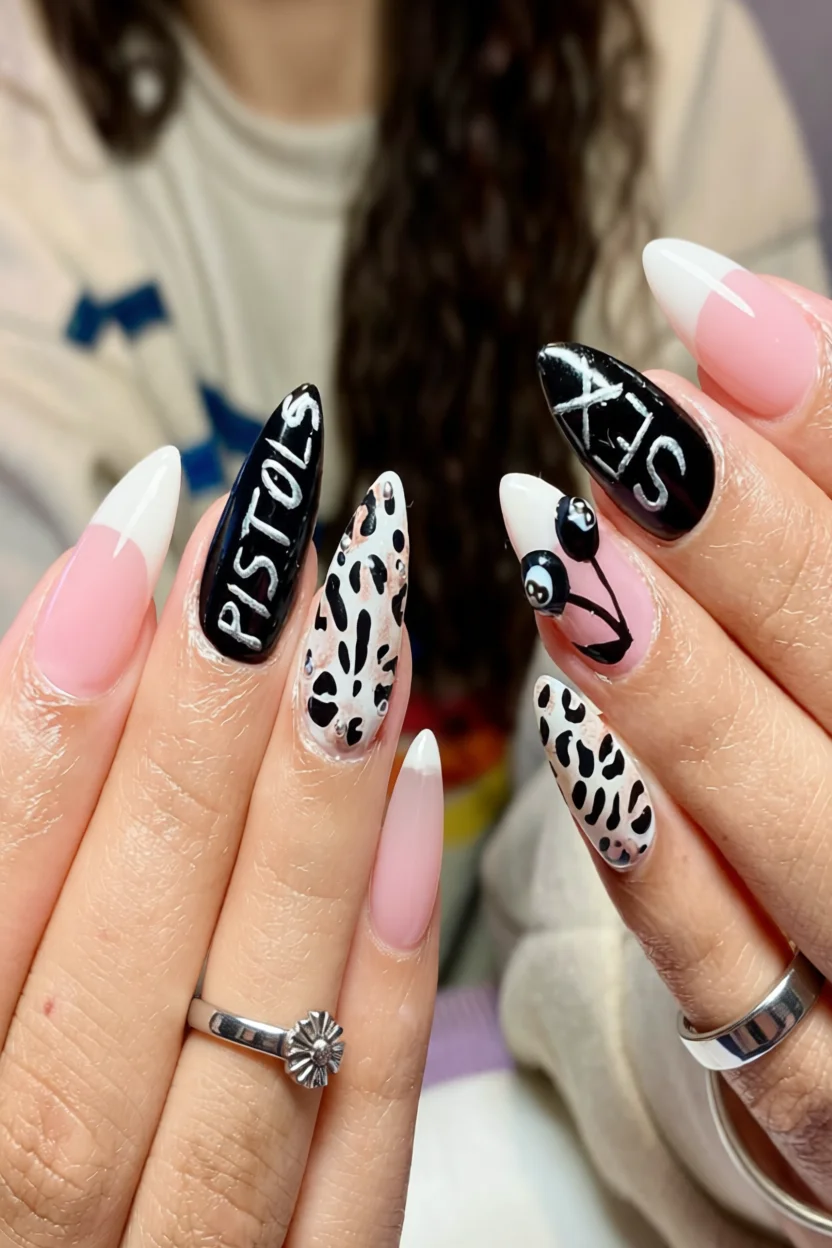 Uñas stiletto con diseños mixtos: francés rosa, letras blancas sobre negro, estampado leopardo con brillantes y bolas de billar 8